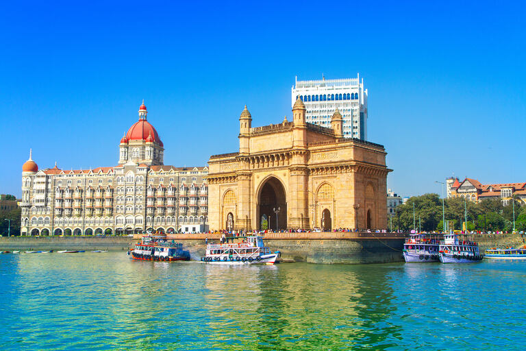 gateway of india with water and taj hotel